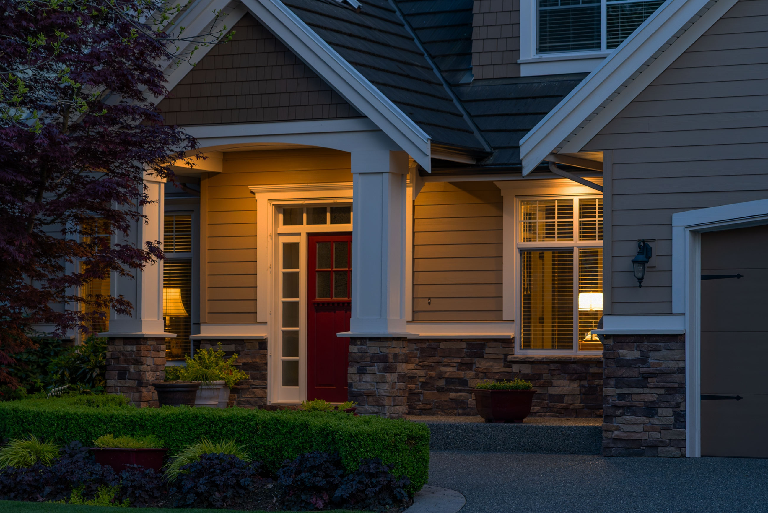 Two-story home protected at dusk